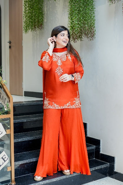 Vibrant Orange Natural Crepe Sharara Set with Intricate Gold Zari & Floral Embroidery