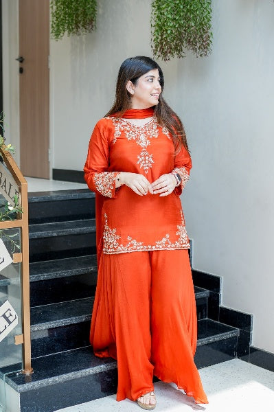 Vibrant Orange Natural Crepe Sharara Set with Intricate Gold Zari & Floral Embroidery